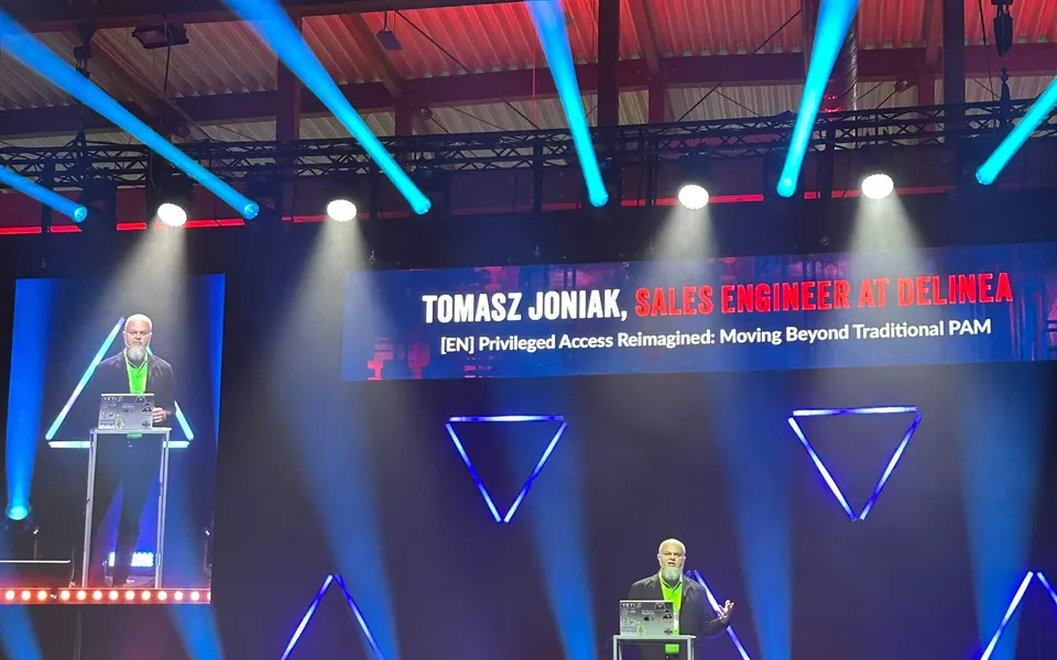 Tomasz Joniak on the CONFidence 2025 main stage in Kraków, presenting Privileged Access Reimagined